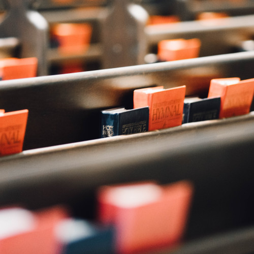 bibles and hymns in rows
